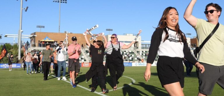 Unsung Heroes of the Year celebrating at Orange County Soccer Club game in Irvine