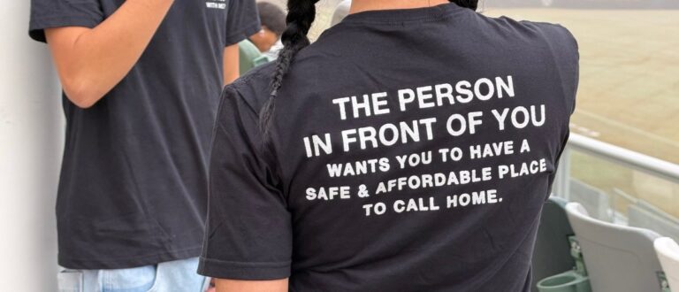 An Orange County resident wearing "The Person in Front of You" campaign t-shirt at the community aerial photo event.