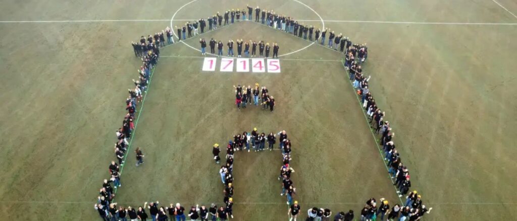 17,145 is spelled out as the number of people who are experiencing homelessness in Orange County as volunteers form the shape of a home, December, 13, 2025, at the Championship Soccer Stadium in Great Park, Irvine. (Photo by Steven Georges, Contributing Photographer)