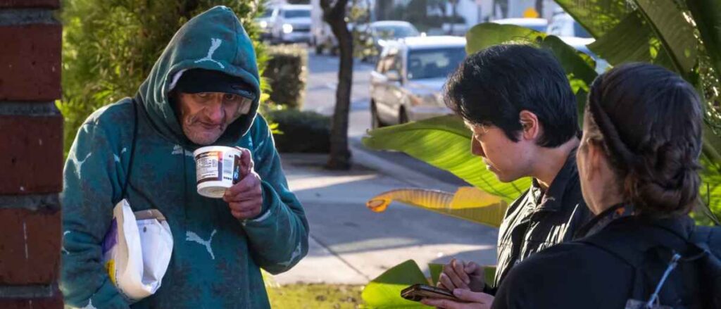 City Net Data Specialist Stephen Su and Julie Bechtol, manager in the OC Office of Care Coordination, right, talk to a man for the Everyone Counts, Point In Time survey in Tustin, CA on Tuesday, January 27, 2026. The county-wide survey provides data on the homeless population. (Photo by Paul Bersebach, Orange County Register/SCNG)
